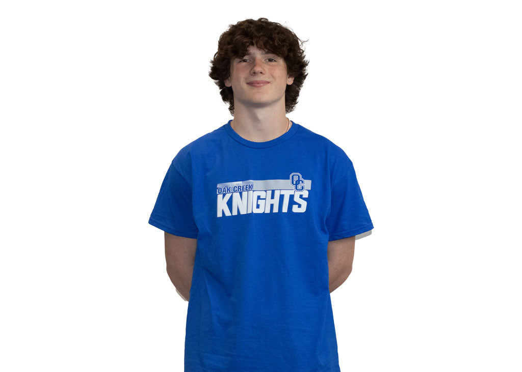 Royal blue t shirt with knights across the center of the shirt