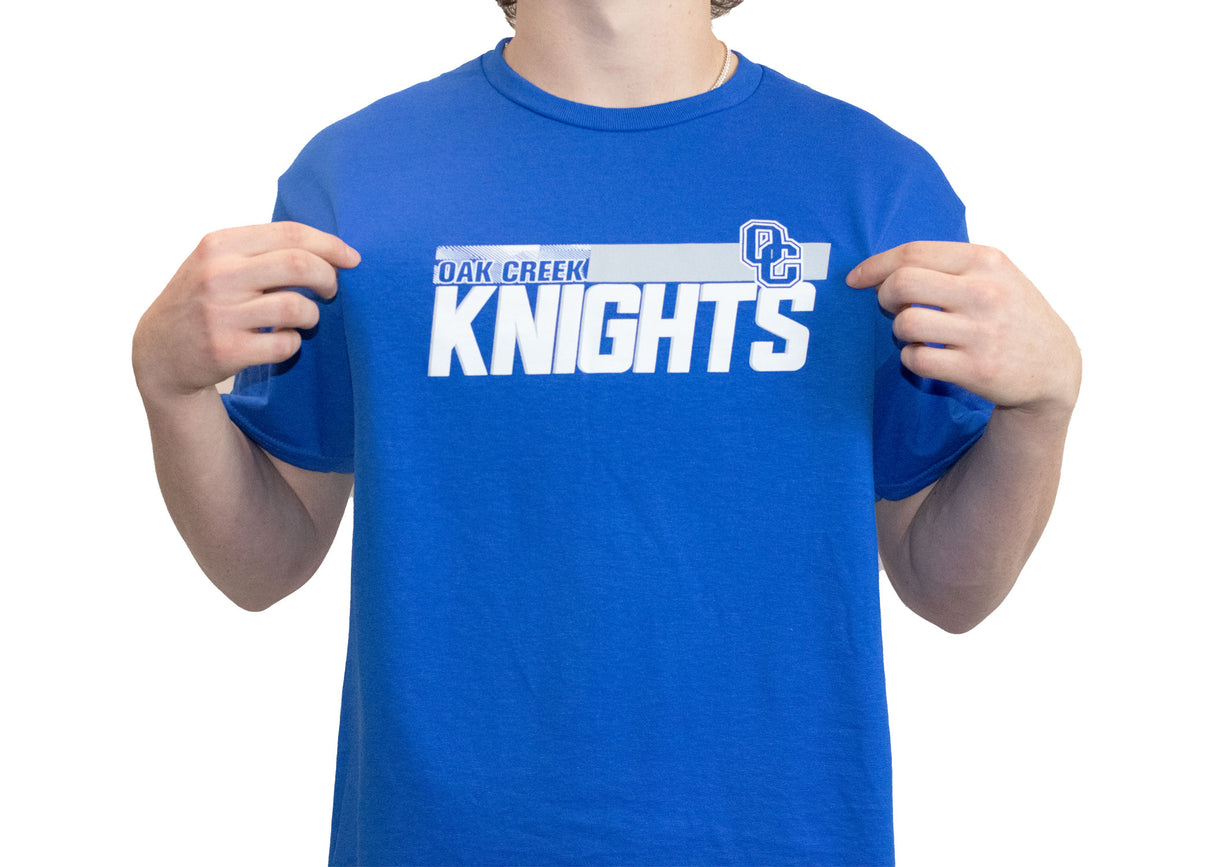 Royal blue t shirt with knights across the center of the shirt