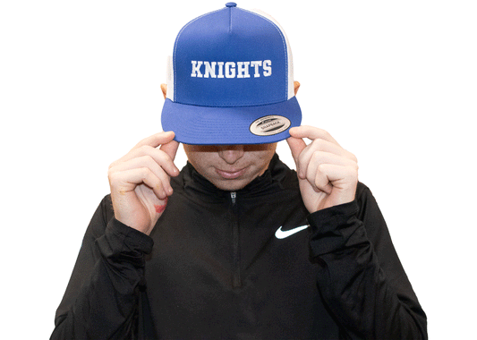 Royal blue snapback hat with flat brim and white mesh back. Knights writing in white across the front