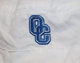 Closeup view of all white bucket hat and embroidered blue and white OC logo.