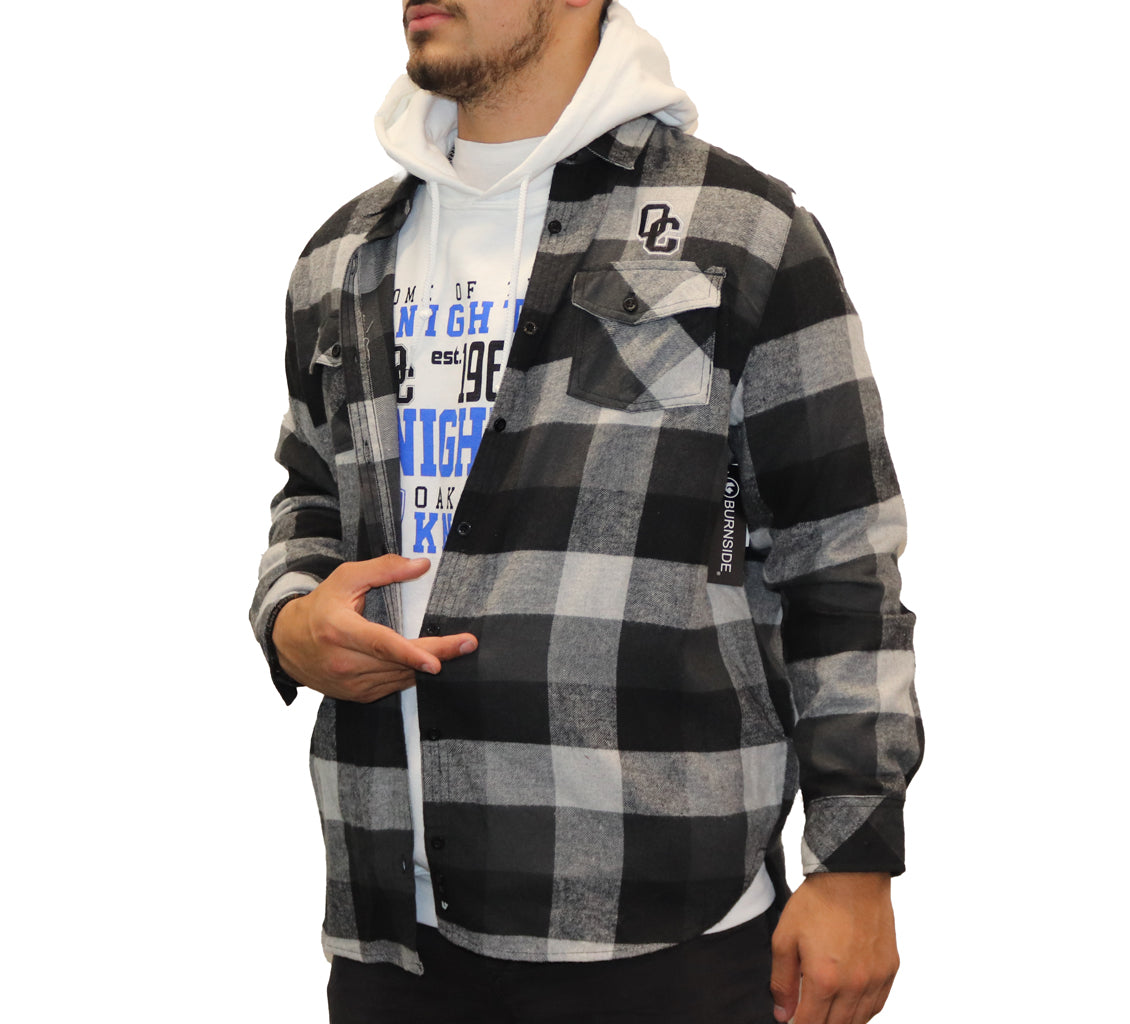 Gray,black and white button up plaid flannel  with buttoned pockets on left and right chest and a black and white OC logo on the upper left chest.