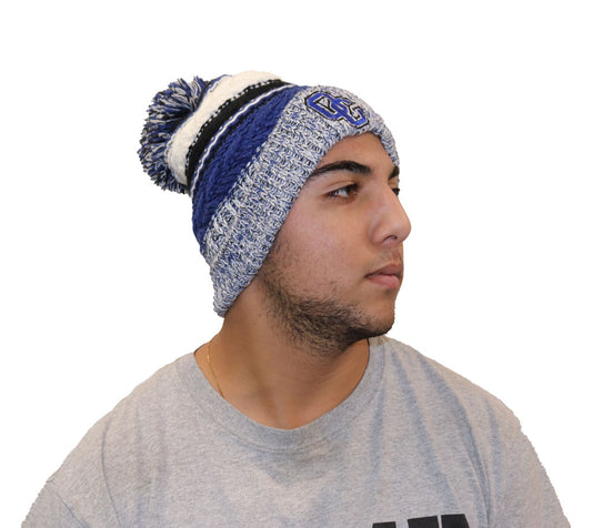 Blue, black, and white hat with puff ball at the top. OC logo on fold over