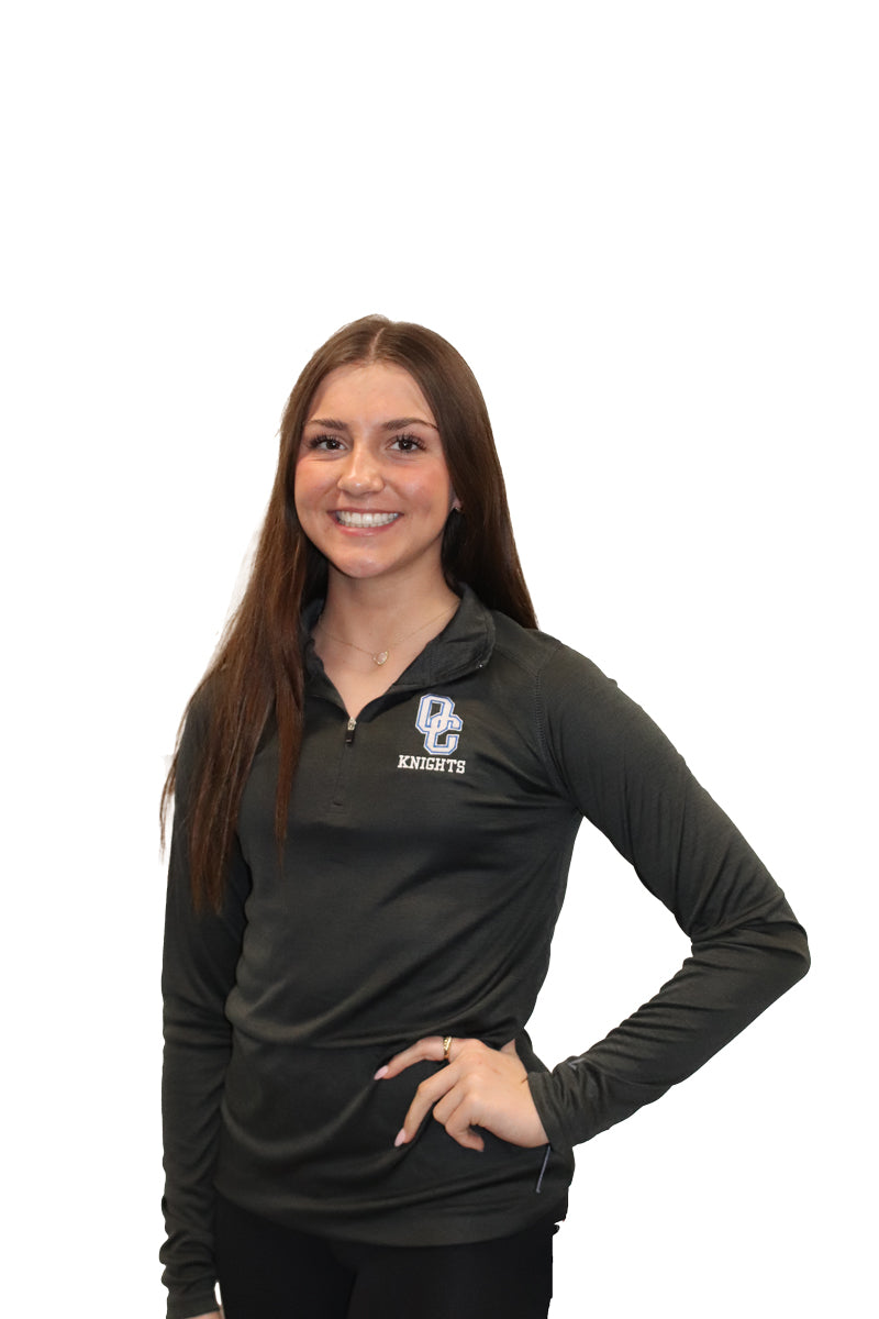 Young woman wearing a black Oak Creek Knights quarter zip.